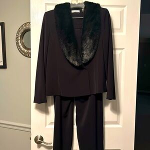Black dressy pantsuit with stylish faux lapels
Size 12
Amanda Smith design
